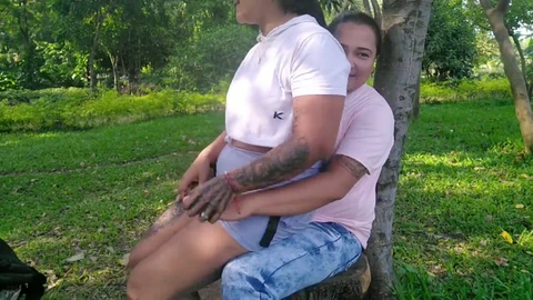 Best friends explore pleasure in the public park with a dildo